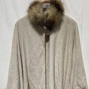 Dino Gaspari brand beige 100 % Angora cape with raccoon fur trim. Size large